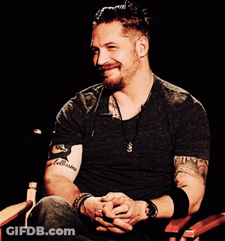 A Man With A Tattoo On His Arm That Says " Bellissime " GIF