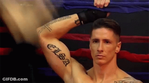 A Man With A Tattoo On His Arm That Says " Elisa " GIF
