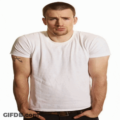 A Man With A Tattoo On His Arm Wears A White T-Shirt GIF