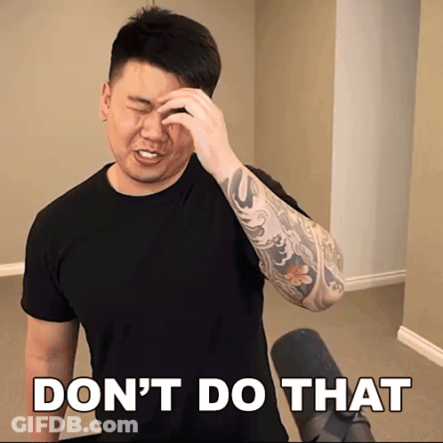 A Man With A Tattoo On His Arm Wipes His Forehead In Front Of A Sign That Says Do N't GIF