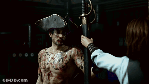 A Man With A Tattoo On His Back Holding Two Swords GIF