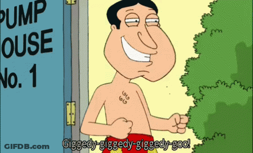 A Man With A Tattoo On His Chest Is Standing In Front Of A Pump House GIF