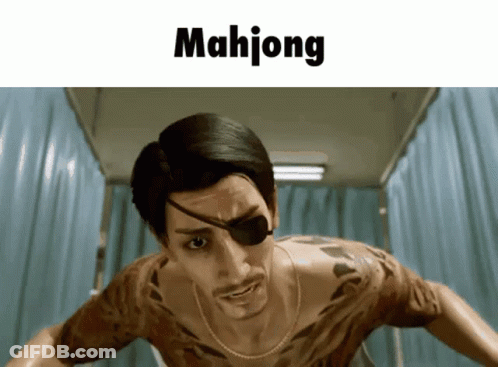 A Man With A Tattoo On His Chest Is Standing In Front Of A Sign That Reads Mahjong GIF
