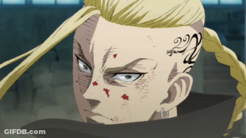 A Man With A Tattoo On His Face Has The Number 22 On His Forehead GIF