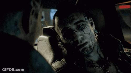 A Man With A Tattoo On His Face Is Sitting In A Car With Another Man GIF