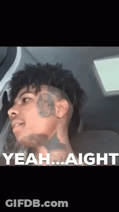A Man With A Tattoo On His Face Is Sitting In A Car With The Words Yeah Aight Behind Him GIF