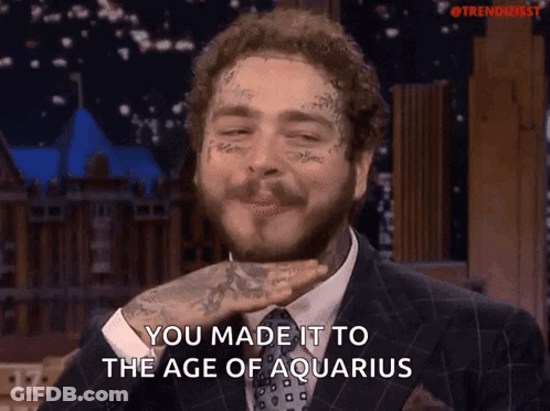 Man With Face Tattoo Saying You Made It To The Age Of Aquarius GIF