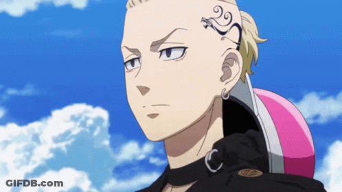 A Man With A Tattoo On His Forehead Holds A Pink Helmet GIF