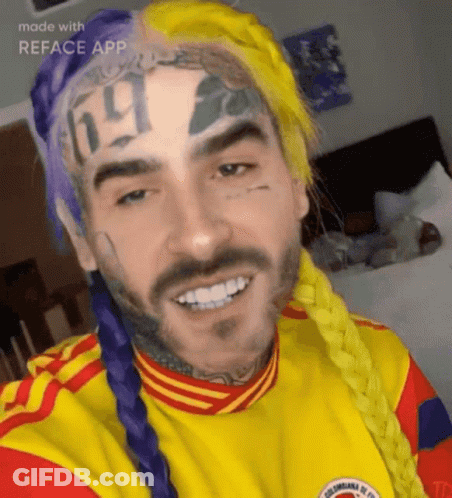 A Man With A Tattoo On His Forehead That Says ' 69 ' On It GIF