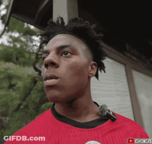 A Man With A Tattoo On His Neck Is Wearing A Red Shirt That Says All American On It GIF
