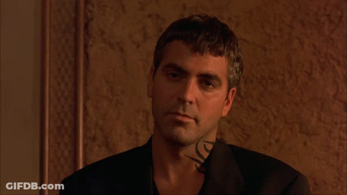 A Man With A Tattoo On His Neck Is Wearing A Suit GIF