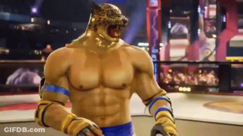 A Man With A Tiger Head Is Standing In A Boxing Ring In A Video Game . GIF