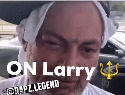 A Man With A Towel Around His Head And The Words " On Larry " Above Him GIF