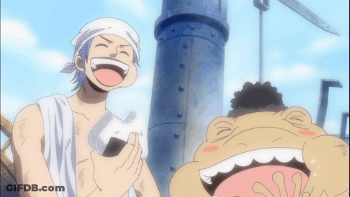 A Man With A Towel Around His Head Is Laughing Next To A Frog GIF