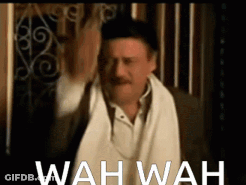 A Man With A Towel Around His Neck And The Words Wah Wah Written Below Him GIF