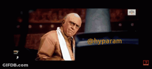 A Man With A Towel Around His Neck Is Making A Funny Face With The Words @Hyparam Below Him GIF