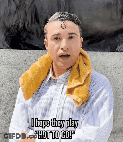 A Man With A Towel Around His Neck Says " I Hope They Play " Hot To Go " GIF