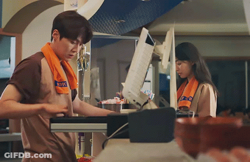 A Man With A Towel Around His Neck That Says ' Nbc ' On It GIF