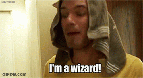 A Man With A Towel Wrapped Around His Head Is Saying I 'M A Wizard . GIF