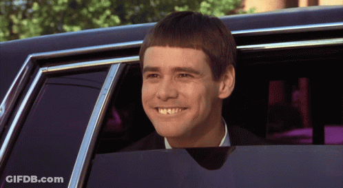 A Man With A Very Short Haircut Is Smiling While Looking Out Of A Car Window GIF