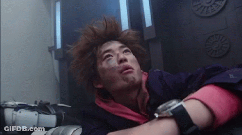 A Man With A Watch On His Wrist Is Laying Down In A Room . GIF