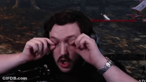 A Man With A Watch On His Wrist Is Making A Face With His Hands GIF