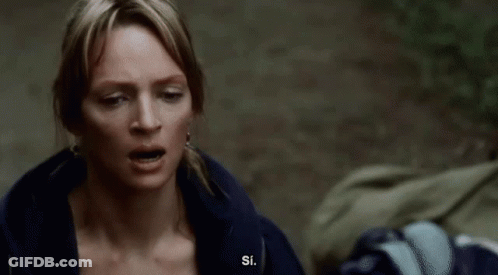 A Man With A White Beard And Eyebrows Looks At The Camera GIF