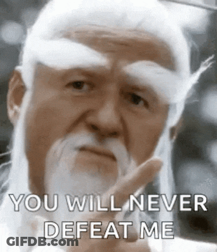 A Man With A White Beard And Mustache Is Giving The Middle Finger . GIF