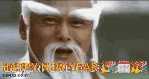 A Man With A White Beard And White Eyebrows Says Happy New Year GIF