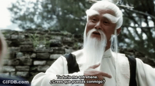 A Man With A White Beard Is Talking In A Foreign Language GIF