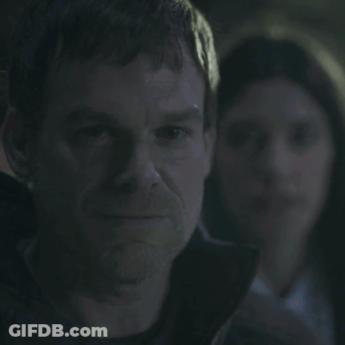 A Man With A Woman In The Background And The Words You Smug Fuck GIF
