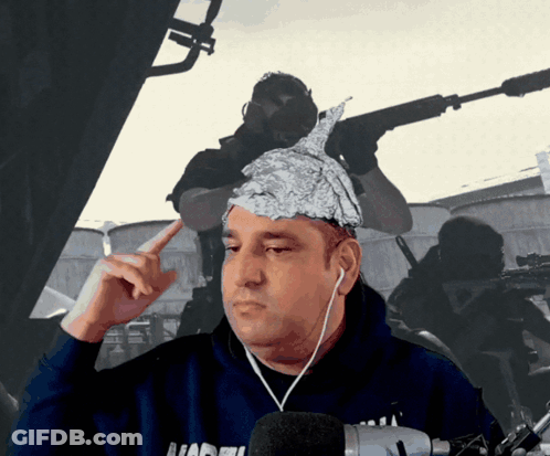 A Man With Aluminum Foil On His Head Is Wearing Headphones And A Hoodie That Says ' Nadel ' On It GIF