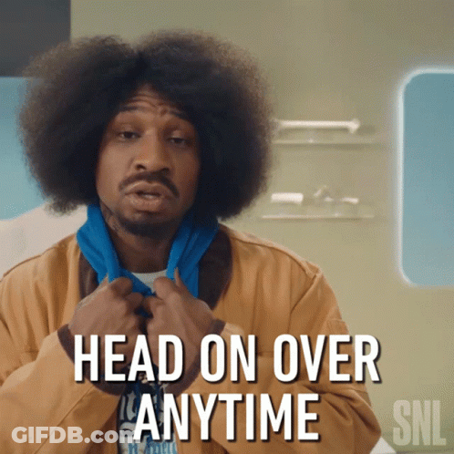 A Man With An Afro And A Scarf Around His Neck Says Head On Over Anytime Snl GIF