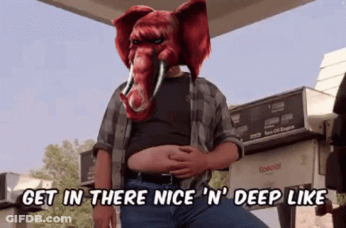 A Man With An Elephant Mask On His Head Says Get In There Nice N ' Deep Like GIF