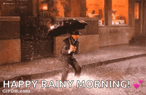 A Man With An Umbrella Is Jumping In The Rain With The Words Happy Rainy Morning GIF