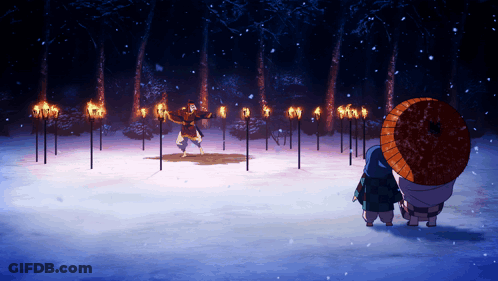 A Man With An Umbrella Stands In Front Of A Row Of Torch Posts GIF