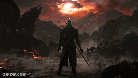 A Man With Arrows In His Back Stands In Front Of A Mountain GIF