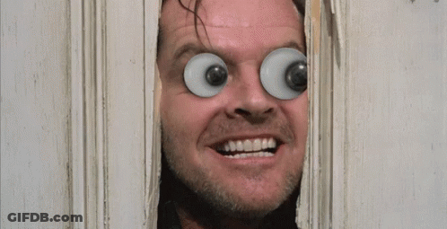 A Man With Big Eyes Looks Through A Hole In A Door With The Words Here 'S Johnny Written On It GIF