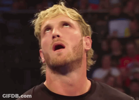 A Man With Blonde Hair And A Beard Is Looking Up At Something GIF