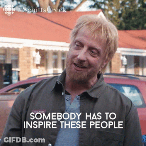 A Man With Blonde Hair And A Beard Is Smiling And Says Somebody Has To Inspire These People On The Bottom GIF