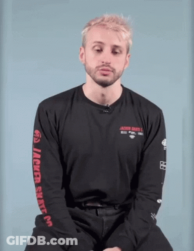 A Man With Blonde Hair And A Beard Is Wearing A Black Shirt With The Word Jackie On The Front . GIF