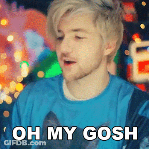 A Man With Blonde Hair And A Beard Is Wearing A Blue Shirt That Says Oh My Gosh GIF