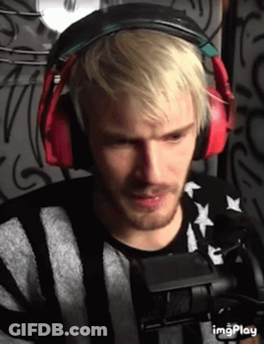 A Man With Blonde Hair And A Beard Wearing Headphones GIF