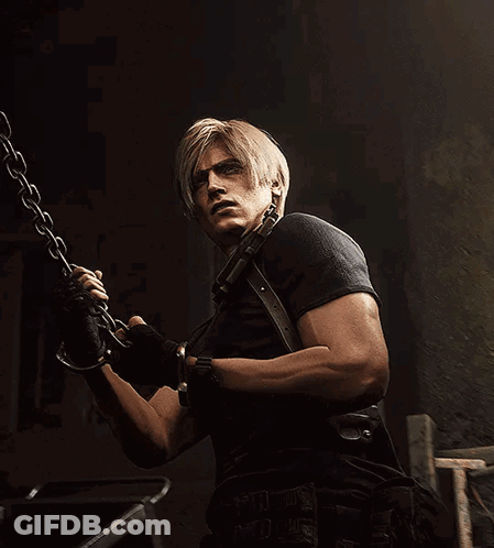 A Man With Blonde Hair And A Black Shirt Is Holding A Chain GIF