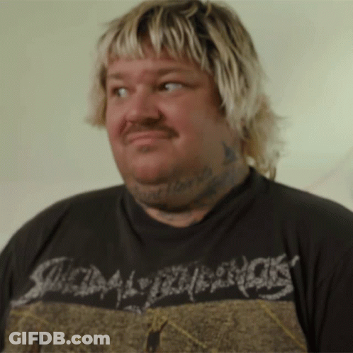 A Man With Blonde Hair And A Tattoo On His Neck Is Wearing A Shirt That Says Scum GIF