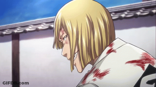 A Man With Blonde Hair And A White Shirt With The Letter F On The Back GIF