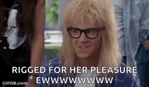 A Man With Blonde Hair And Glasses Is Smiling And Saying `` Rigged For Her Pleasure Ewwwwww . '' GIF
