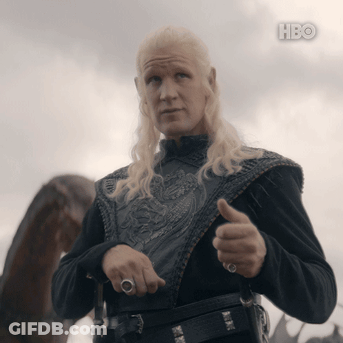 A Man With Blonde Hair Is Giving A Thumbs Up In Front Of A Cloudy Sky With Hbo Written On The Bottom GIF