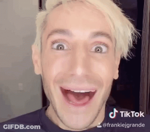 A Man With Blonde Hair Is Making A Funny Face . GIF