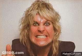 A Man With Blonde Hair Is Making A Very Angry Face . GIF